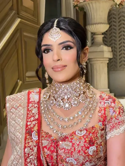 Another angle of this regal bridal look. The HD makeup provides a flawless finish that lasts through all the ceremonies, ensuring you look perfect from every angle.