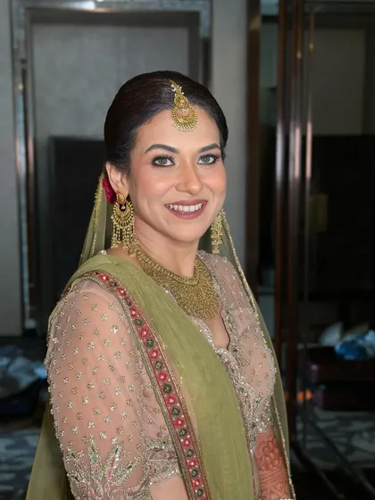 A happy, smiling portrait, her joy is infectious and her makeup looks perfect.