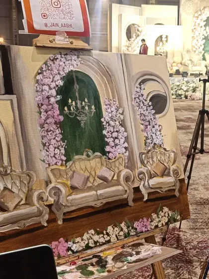 My easel and a work-in-progress painting of the stage decor at Orana Conventions, Gurugram. I always start by capturing the setting to create a complete memory of the day.