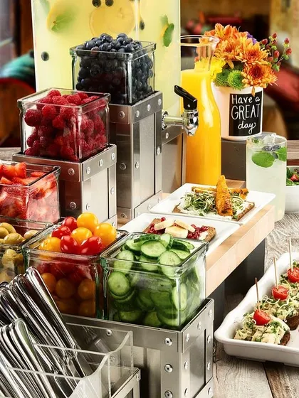 A beautiful Sunday brunch, ready for our clients. This setup features a fresh salad and appetizer bar with a variety of toppings and ingredients, perfect for a relaxed get-together.