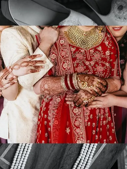 An artistic collage focusing on the textures and colors of the wedding. The bride's red lehenga, the groom's white sherwani, and the bridesmaids' dresses come together beautifully.