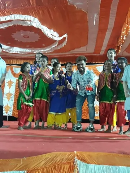 On stage with my students after a successful performance for a Lohri festival. We incorporated traditional Punjabi dance elements into a fun, energetic routine.