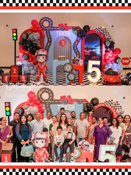 Start your engines! A race car-themed 5th birthday for Taksh, featuring a checkered flag motif, a race track backdrop, and a cool driver character cutout.