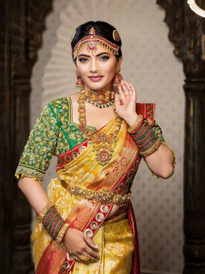 This detailed photoshoot showcases a complete South Indian bridal look, from the intricate matha patti and layered necklaces to the flawless airbrush makeup and traditional saree draping.