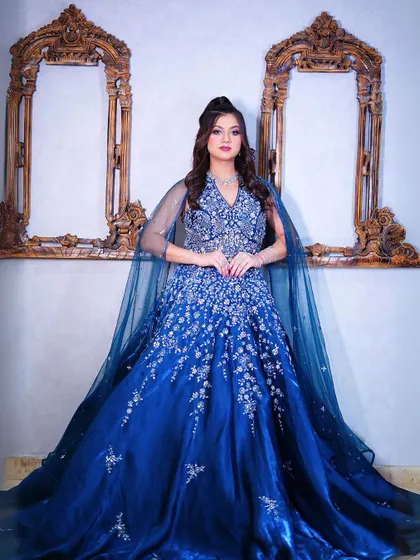 A final full-length view of the stunning blue ball gown.