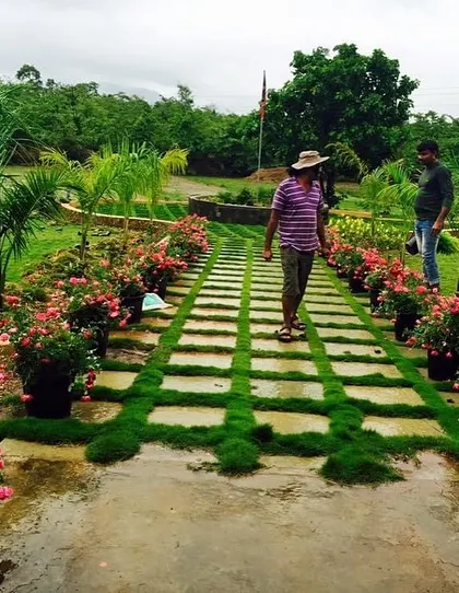 A complete tour of the stud farm project. The images showcase the unique architecture of the stables, the expansive green lawns, and the checkerboard pathways, all designed to be in harmony with nature.
