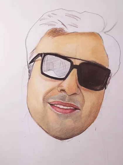 A look at a color pencil portrait in progress. I often work in sections, completing the face and skin tones before moving on to the hair and clothing.