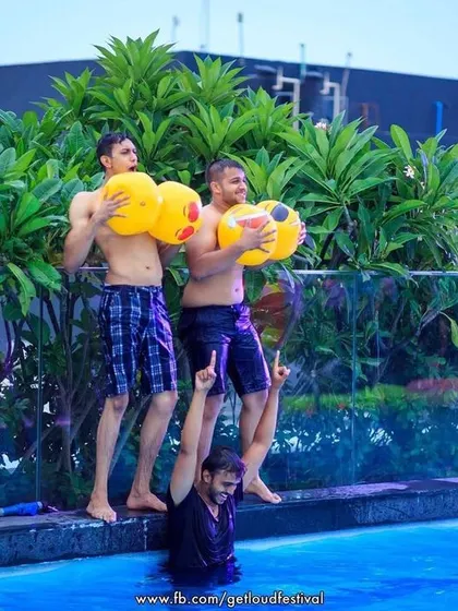 Some fun and games by the pool, with guests showing off their strength and humor.