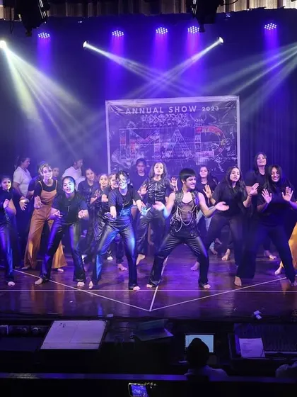 The stage is alive with movement and energy during this group performance at the Tarulya 2023 showcase.