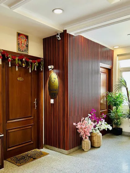 Another view of the entryway, showing how the warm wood tones and soft lighting create a cozy and welcoming ambiance right from the front door.