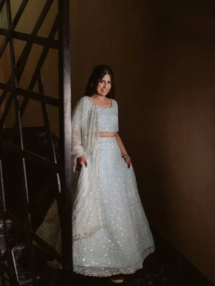 Another beautiful shot of the full reception look. The makeup, hair, and outfit create a cohesive and stunning vision.