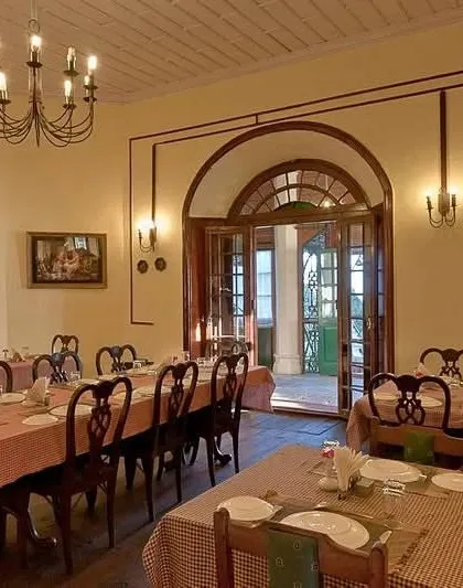 The main dining hall, designed with classic furniture and lighting to complement the hotel's heritage feel.