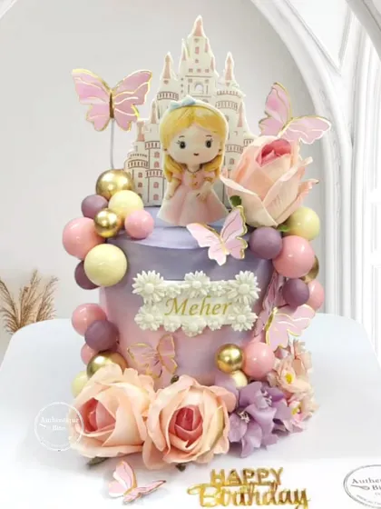 A stunning whipped cream Princess Castle cake. This design proves you don't need fondant for a fairytale creation, featuring a beautiful princess, a castle silhouette, and floral balloon decorations.