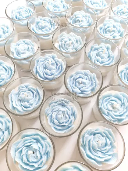 The blue peony votive candles from the same corporate order, highlighting the serene Ocean scent and beautiful floral design.