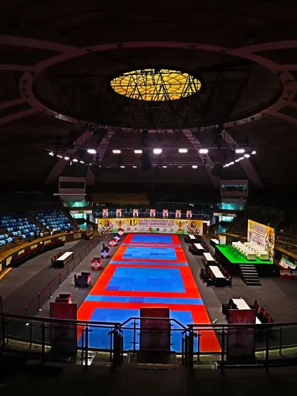 The calm before the storm. The world-class Talkatora Indoor Stadium in New Delhi, fully prepared for the 19th All India Independence Cup Karate Championship, where India's best compete.