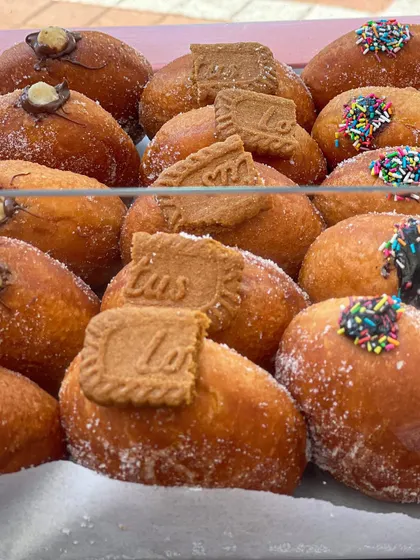 A display of my assorted stuffed donuts at a pop-up event. The Biscoff and Nutella ones are always the first to go.