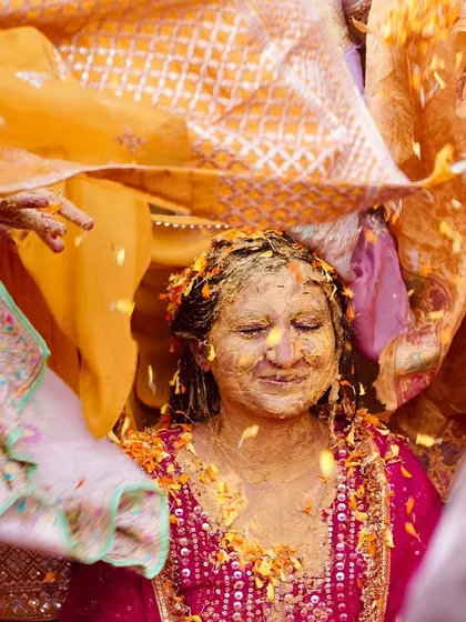 A traditional moment during the haldi where the bride is covered by a decorative cloth. I look for these culturally significant details to tell a complete wedding story.