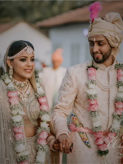 A beautiful portrait of the couple after their Varmala ceremony, looking serene and happy.