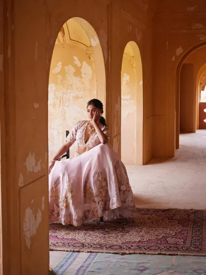 A beautifully composed shot within a heritage location. The architecture and the pastel lehenga come together to create a dreamy, romantic image.