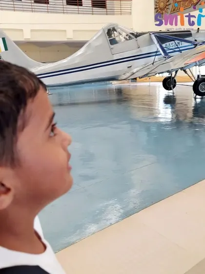 A student looks intently at a vintage aircraft. These excursions provide sensory-rich experiences that cannot be replicated in a classroom.