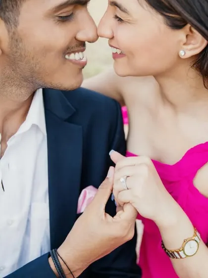 A close-up, intimate moment. The makeup is soft and natural, designed to look perfect in romantic, close-up photos.