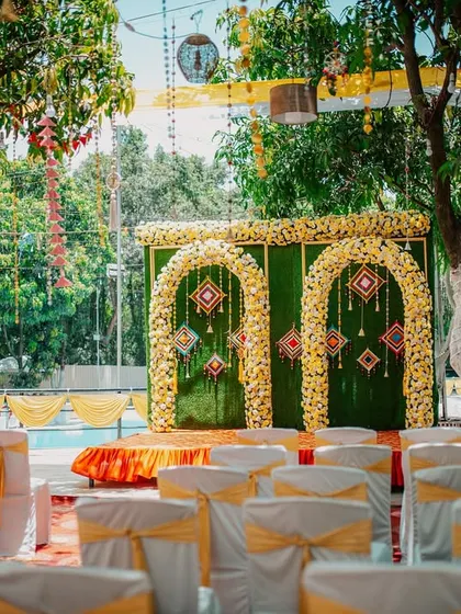 The beautiful and vibrant decor of an outdoor Haldi ceremony, ready for the festivities to begin.