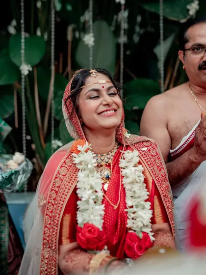 A candid shot of a bride's radiant smile, capturing a moment of pure happiness during her wedding ceremony.