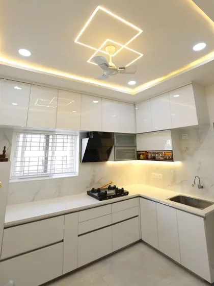 The ceiling is an important part of the kitchen design. Here, we've created a custom ceiling with integrated square-profile lighting that adds a unique and modern architectural element.