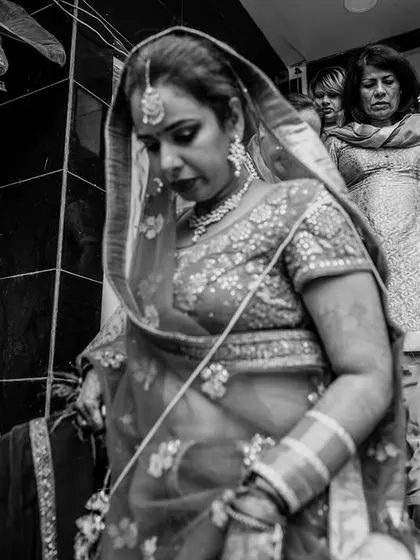 A poignant black and white shot of the bride's departure, with her loyal pug watching from the top of the stairs. A real tear-jerker.