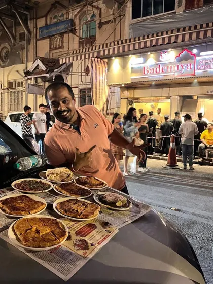 You don't need a fancy restaurant when you have a car bonnet and a feast from Bademiya. Enjoying the street food vibe with a full spread of our famous Baida Roti and other dishes.