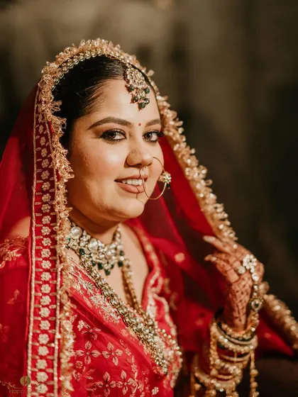 A radiant close-up of the bride, Varnika. Her happy smile and beautiful makeup are perfectly captured in this wedding day portrait.