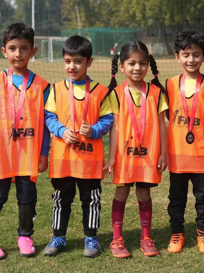 Four young players with their medals. We believe talent without hard work is nothing, and these players have worked hard.