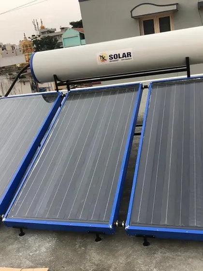 A clear view of the completed 300-liter FPC solar water heater installation. The system is positioned to receive maximum sunlight throughout the day for efficient water heating.