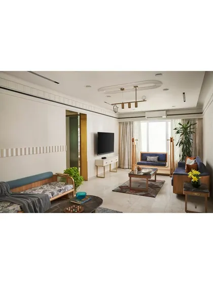 The informal living room, featuring a floor-standing swing and oak wood sofa for a blend of functionality and style.