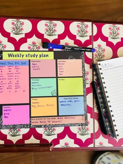 The weekly study planner set up on a lap desk, showing how it can be used anywhere.