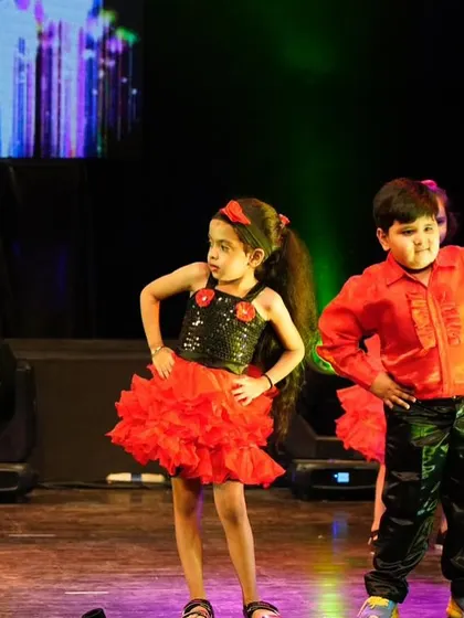 Our youngest performers showing off their desi swag in a Bollywood number. Dressed in vibrant red and black, they brought so much attitude and cuteness to the stage.