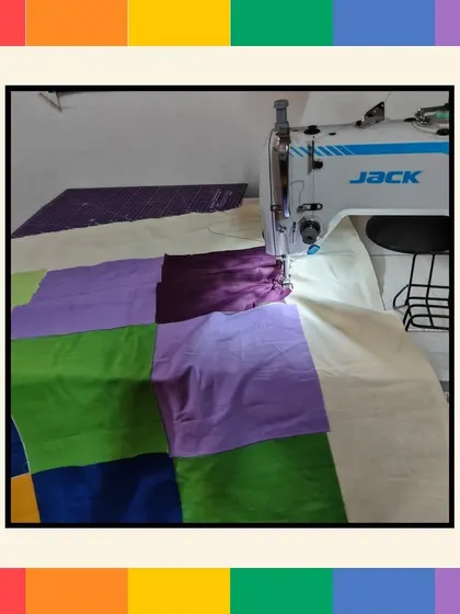 A behind-the-scenes look at the Pride quilt being professionally stitched. We handle all the logistics, from providing the materials for the employee activity to ensuring the final product is beautifully finished.