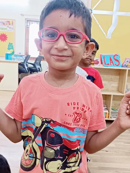 A student showing a happy expression. We encourage children to identify and express their emotions in a healthy way.