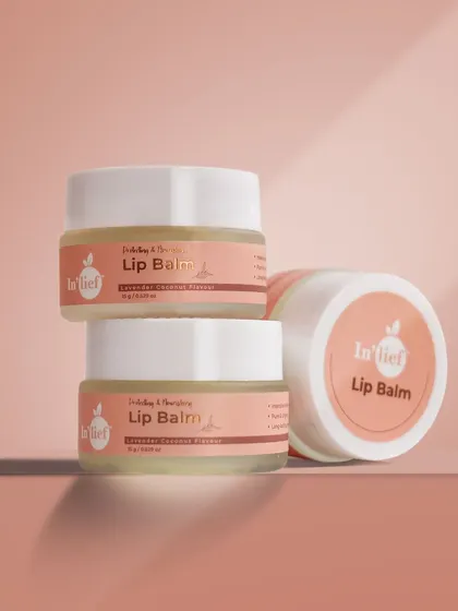 A stacked arrangement of In'lief lip balm jars. This type of shot is great for showing multiple product units or variations in a clean, organized way.