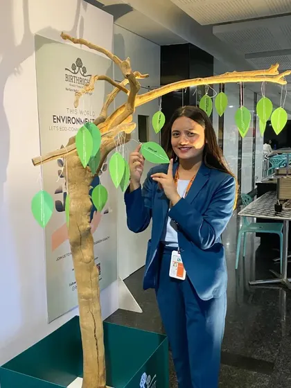 A team member hangs her pledge, showcasing the commitment that runs through our entire organization.