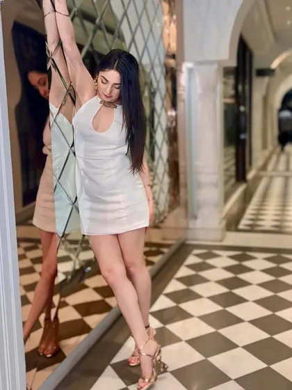 Feeling like a magician in this white mini dress. A playful shot using mirrors to create a cool, artistic effect.