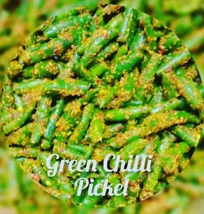 A close-up of the texture of my green chilli pickle. It's made with fresh chillies and a mix of traditional spices for that authentic desi taste.