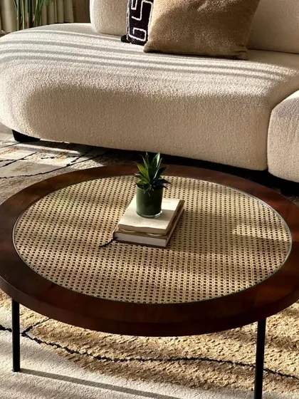 This center table combines a classic dark wood frame and natural cane weaving, protected by a layer of glass. It’s a perfect example of how we blend timeless materials with modern design for a piece that is both beautiful and practical for everyday use.
