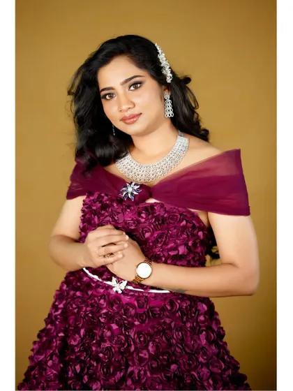This gown can be styled with a sheer shoulder wrap for an elegant, off-shoulder look. The diamond jewelry is also available for rent.