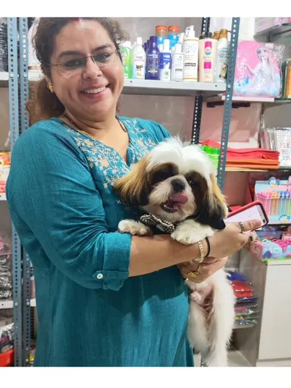 The joy on a pet parent's face says it all. We love seeing our clients happy with their pampered pooch after a visit to our in-house salon.