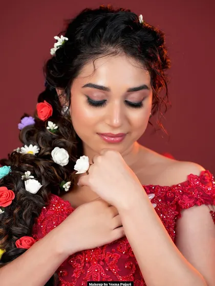 A side view of the magnificent floral braid. This style is a true statement piece, combining intricate braiding with creative floral design.