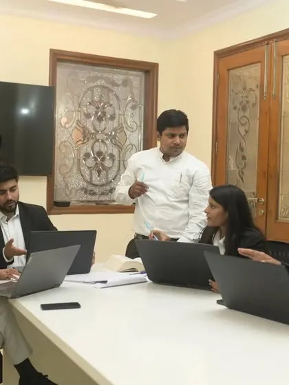A strategy session with my team. We believe in a collaborative approach to case preparation, ensuring every angle is thoroughly examined.