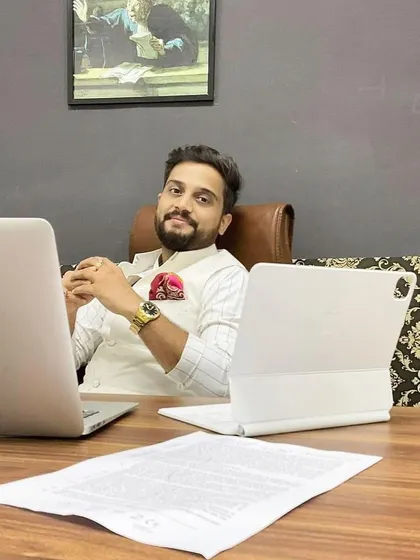 In my office, preparing for a client consultation. I believe that while failure is a risk in any endeavor, the true failure is not trying. This philosophy drives my approach to every case I take on.