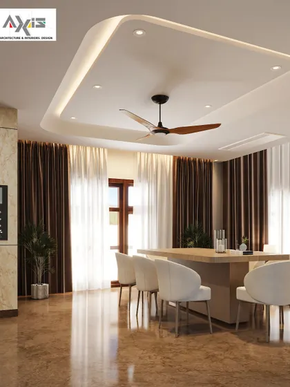 A dining hall designed to be a soulful sanctuary for conversations. The recessed ceiling with cove lighting adds a sense of height and drama, while the simple wooden table and upholstered chairs keep the focus on togetherness.