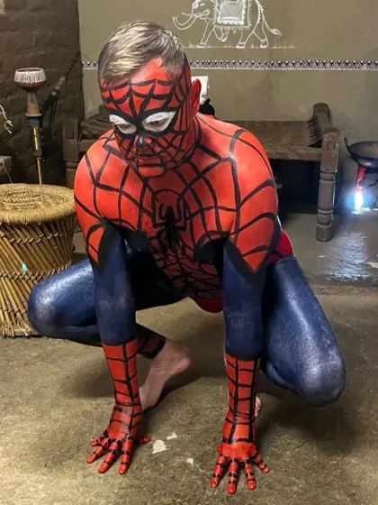 Art isn't just for canvas. Here's a look at a full-body painting project, transforming a client into Spiderman. This showcases the unique and specialized creative services we offer for projects and events.